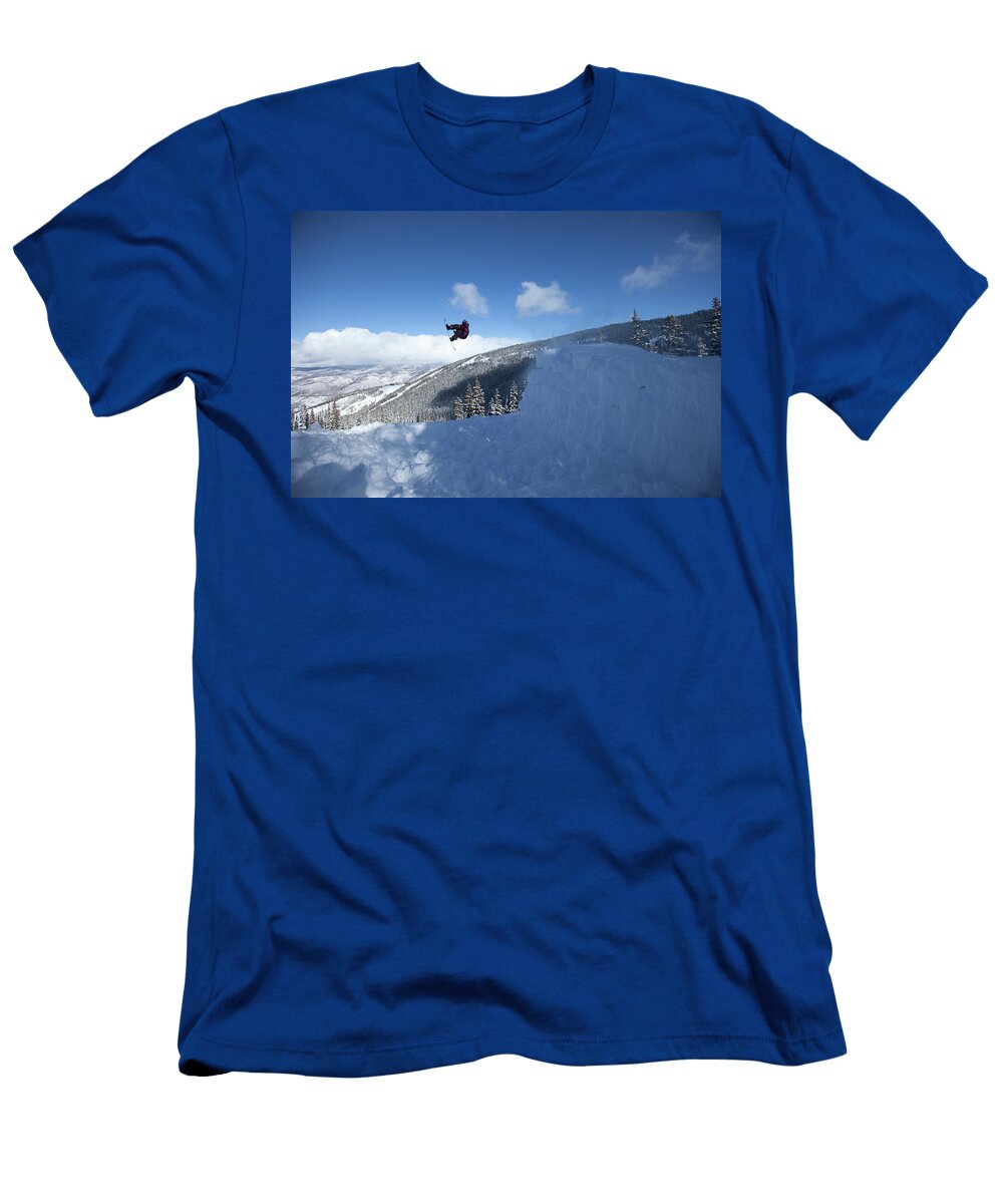 A Male Snowboarder Spinning Off a Jump Patrick Orton T-Shirt